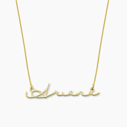 Gold plated signature name necklace from MUHVA STORE, featuring a personalized name pendant on a delicate chain.